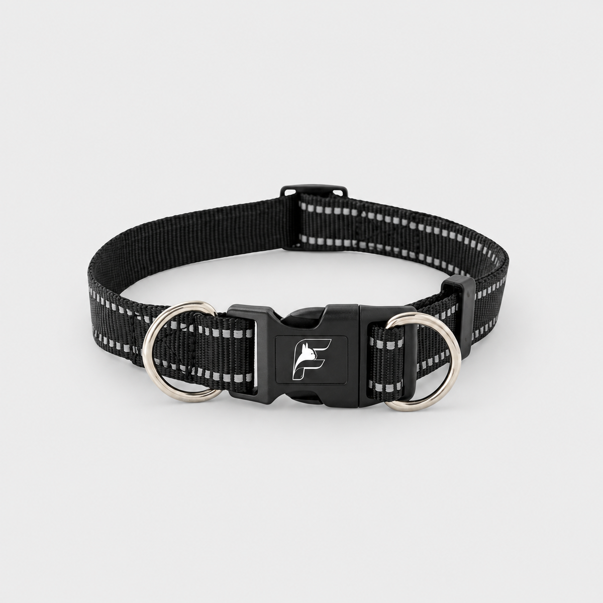 Black reflective dog collar with The Frenchie Shop logo on a light gray background