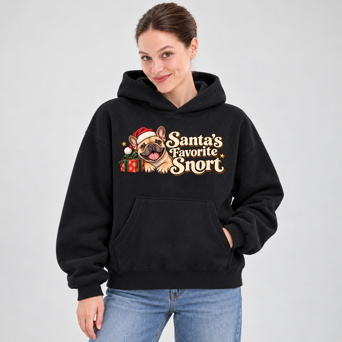 Woman wearing a black French Bulldog hoodie with the Santa's Favorite Snort front print.