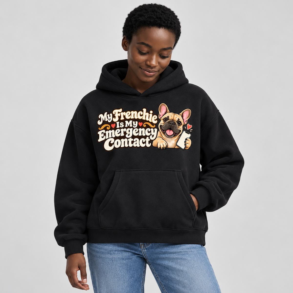 Woman wearing a black French Bulldog hoodie with the My Frenchie Is My Emergency Contact front print.