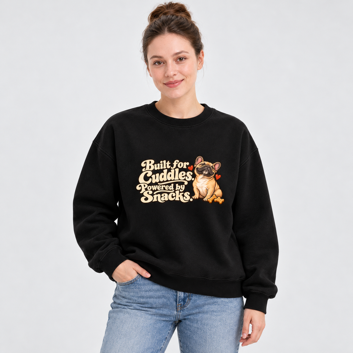 Model wearing a black French Bulldog sweatshirt with Built for Cuddles. Powered by Snacks. on the front