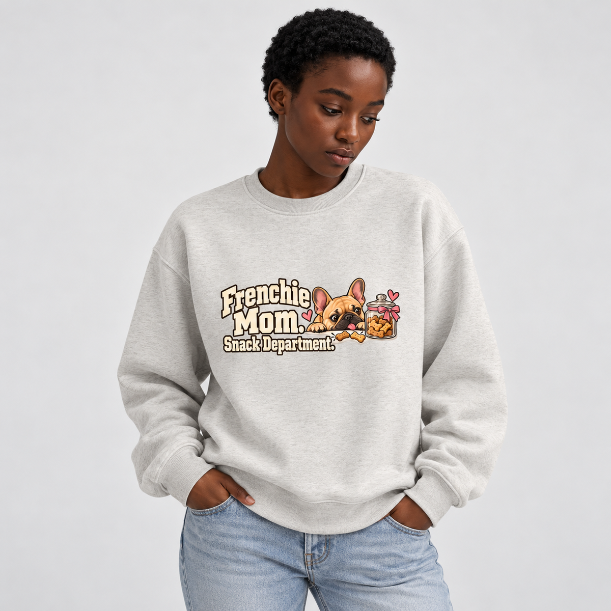 Close-up of Frenchie Mom. Snack Department. front artwork on a oat gray fleece sweatshirt