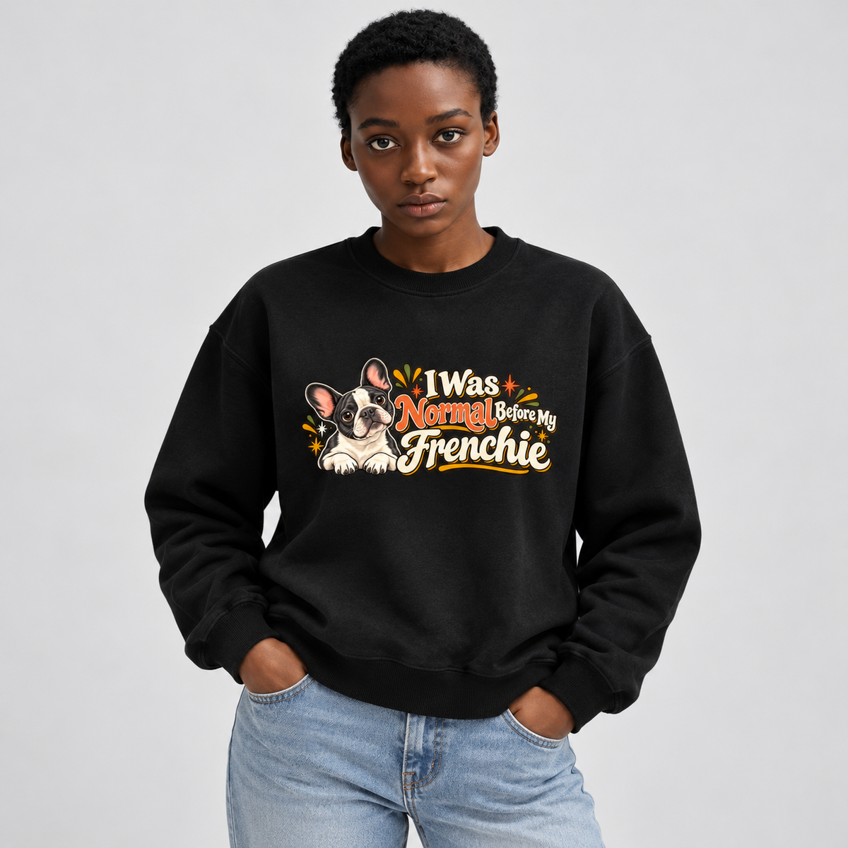 Close-up of I Was Normal Before My Frenchie front artwork on a black fleece sweatshirt