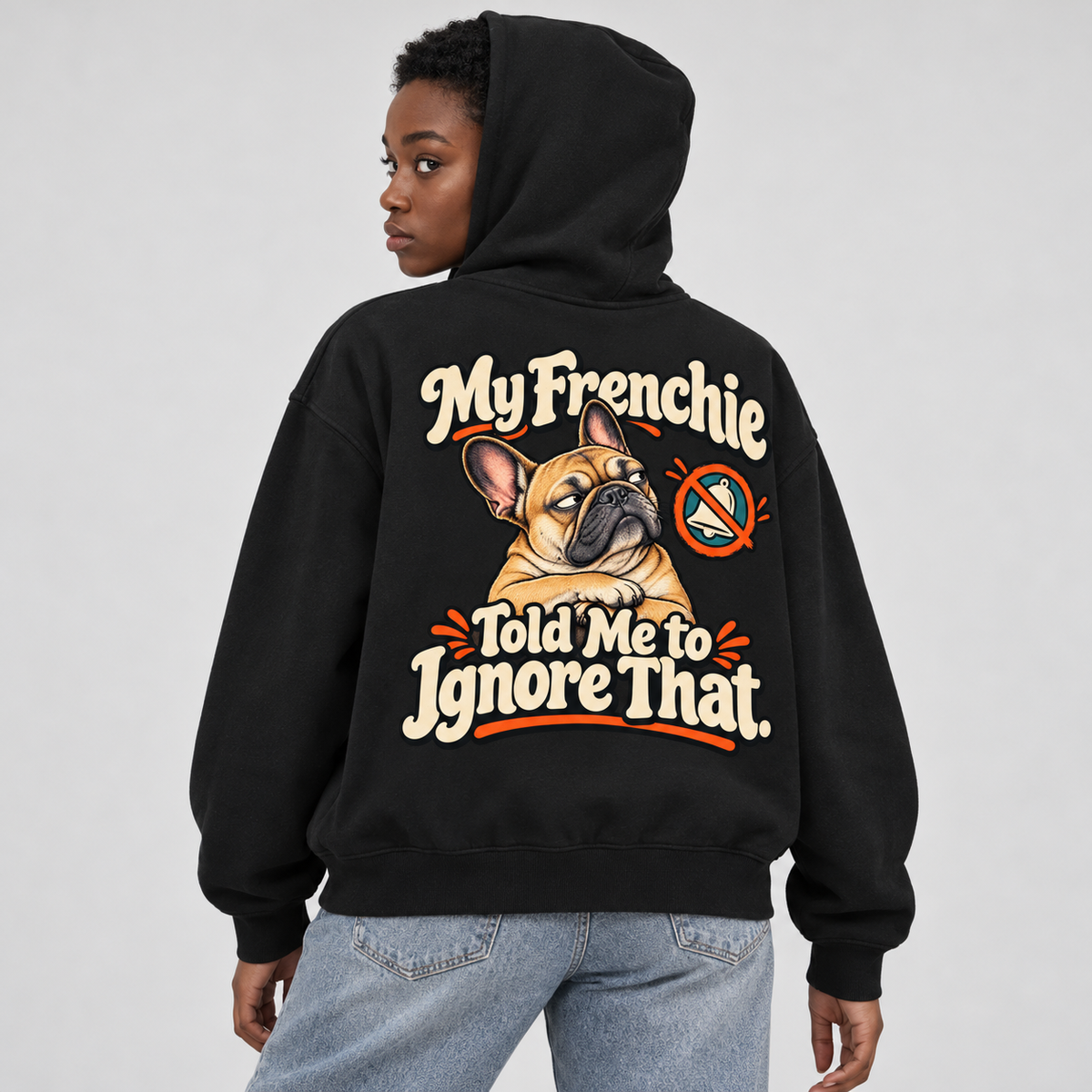 Close-up of the My Frenchie Told Me to Ignore That back print on a black French Bulldog hoodie.