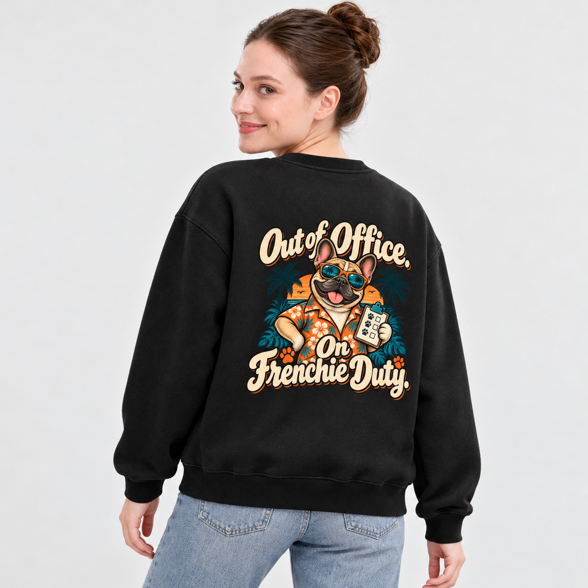 Model wearing a black French Bulldog sweatshirt with Out of Office. On Frenchie Duty. on the back
