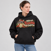 Woman wearing a black French Bulldog hoodie with the Official Frenchie Gift Inspector front print.