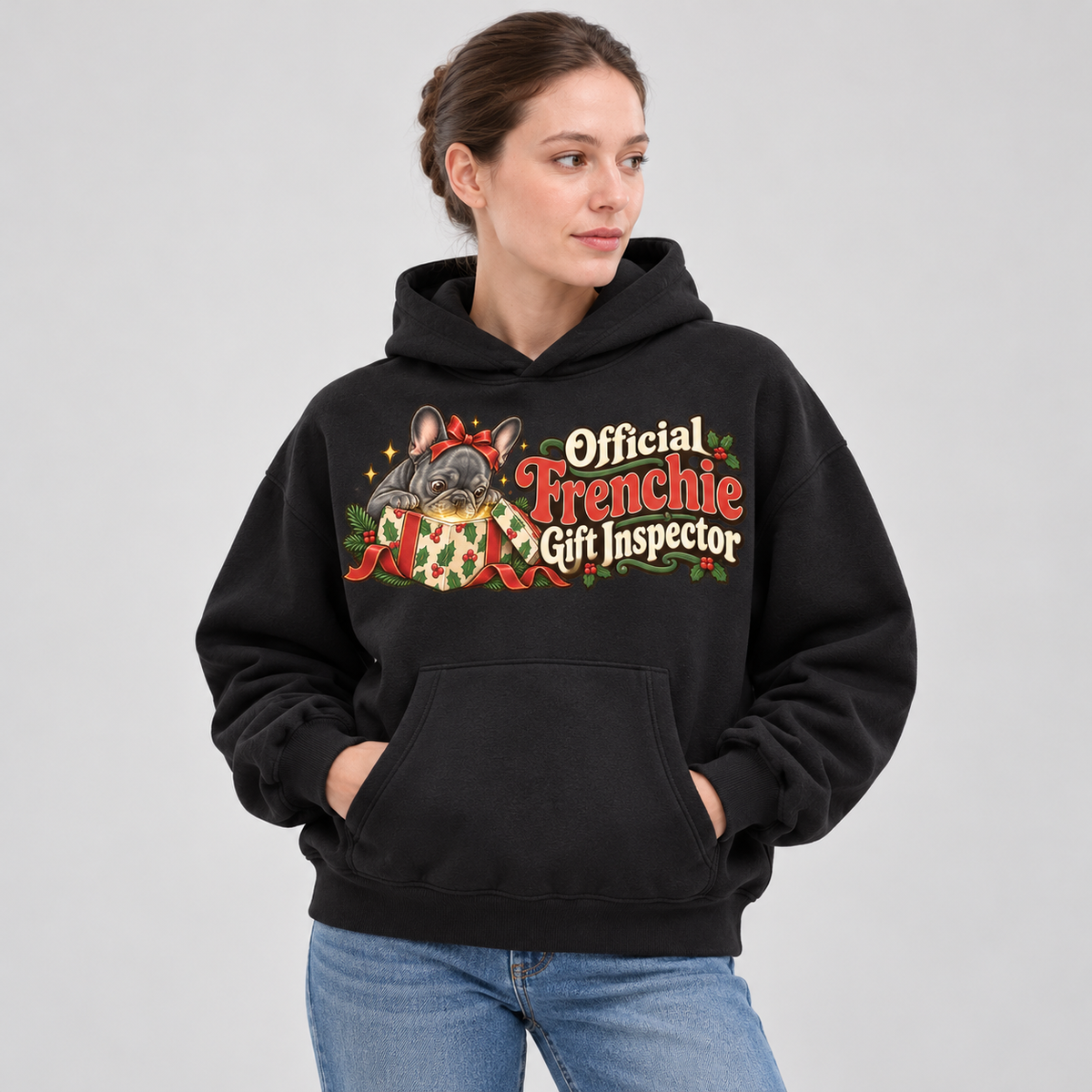 Woman wearing a black French Bulldog hoodie with the Official Frenchie Gift Inspector front print.