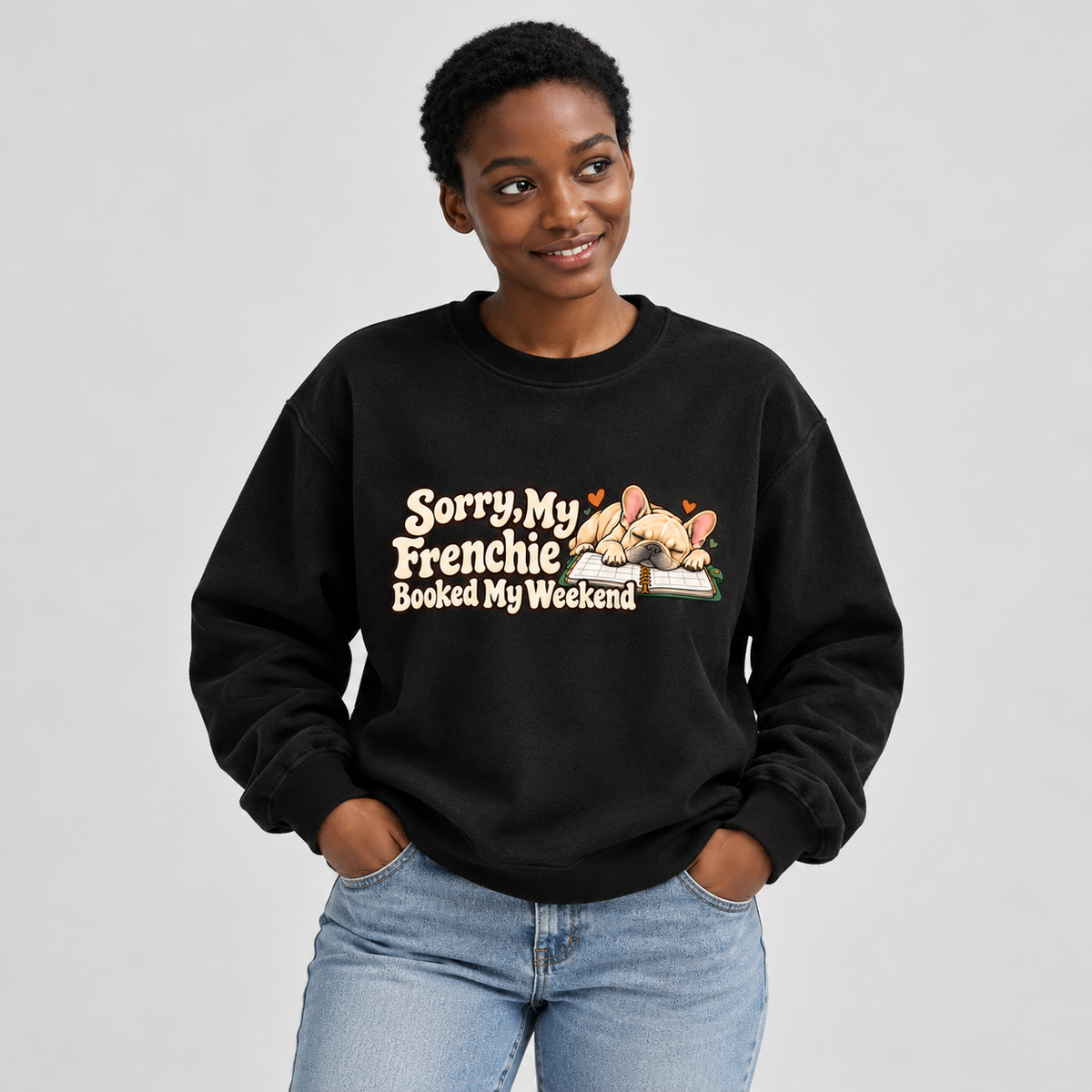 Model wearing a black French Bulldog sweatshirt with Sorry, My Frenchie Booked My Weekend on the front