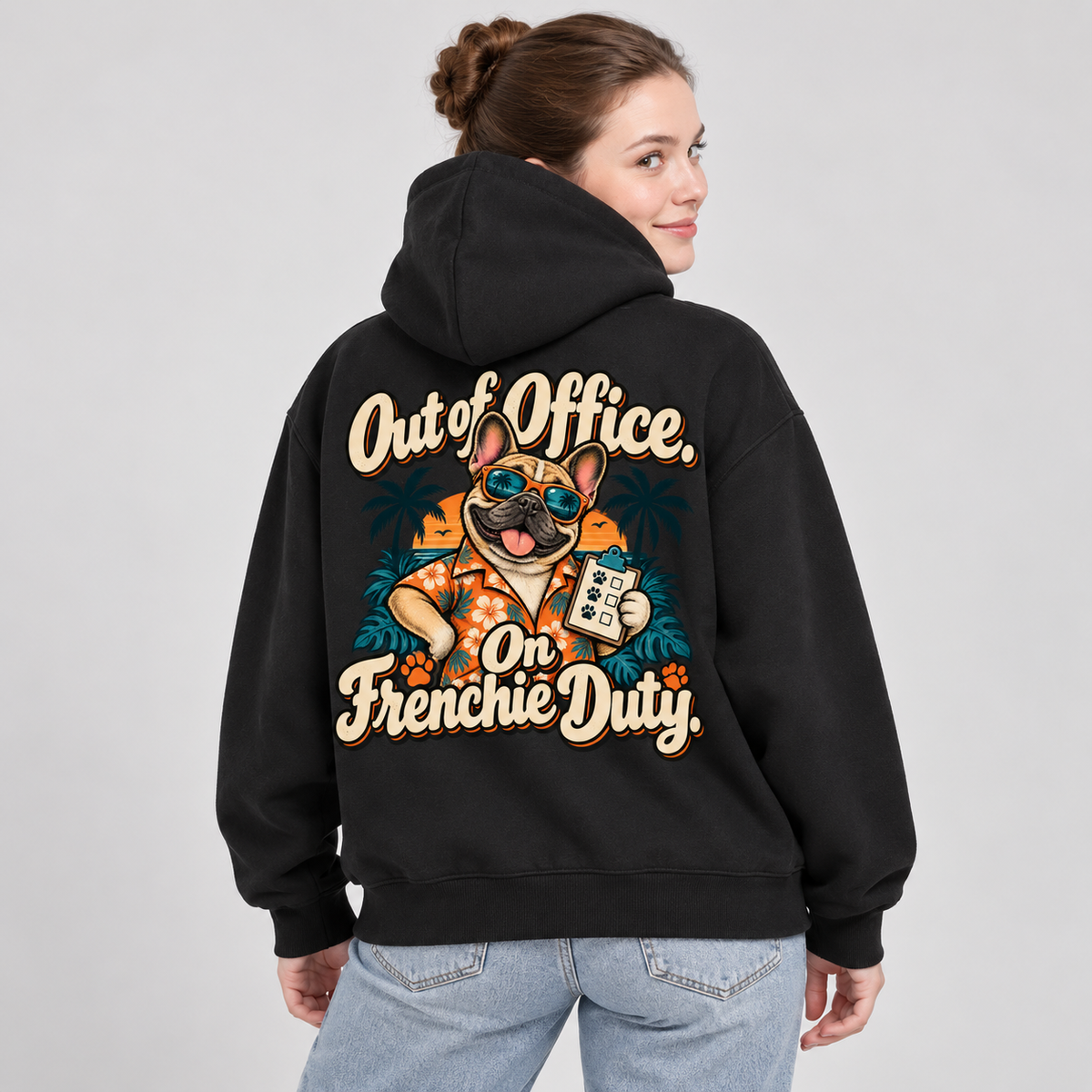 Close-up of the Out of Office. On Frenchie Duty back print on a black French Bulldog hoodie.