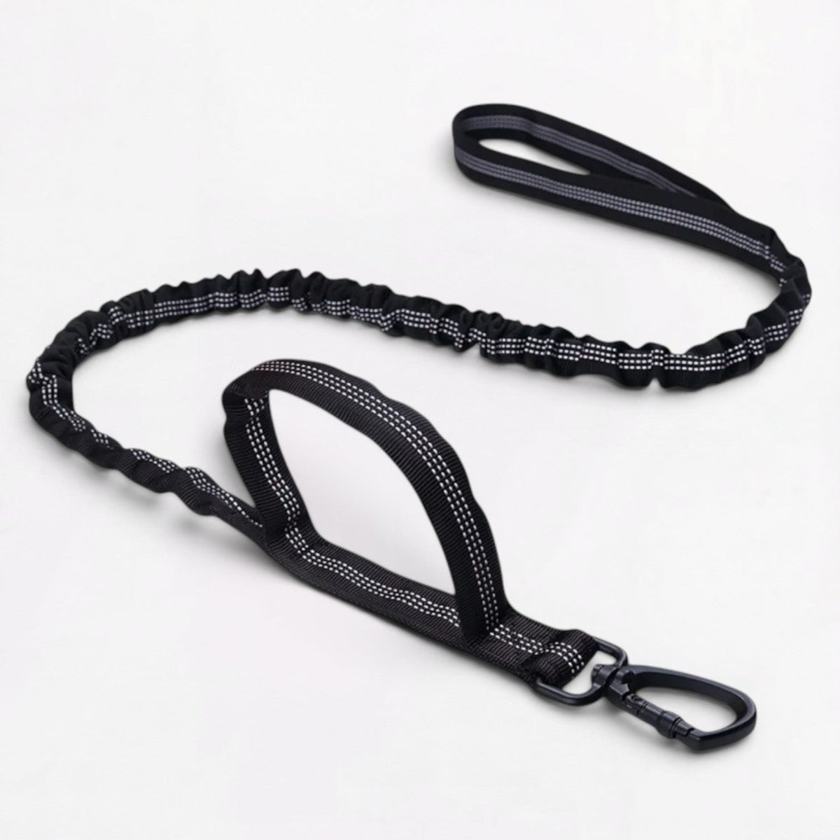 Frenchie harness with a checkered strap pattern instead of plain nylon webbing