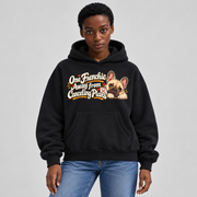 Woman wearing a black French Bulldog hoodie with the One Frenchie Away from Canceling Plans front print.