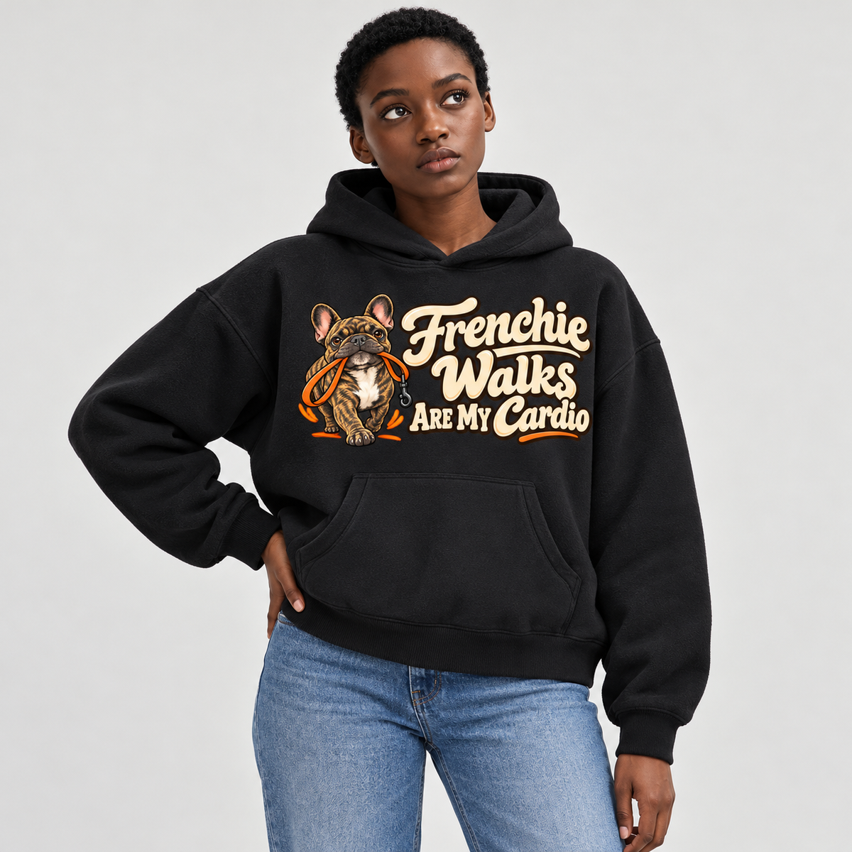 Woman wearing a black French Bulldog hoodie with the Frenchie Walks Are My Cardio front print.