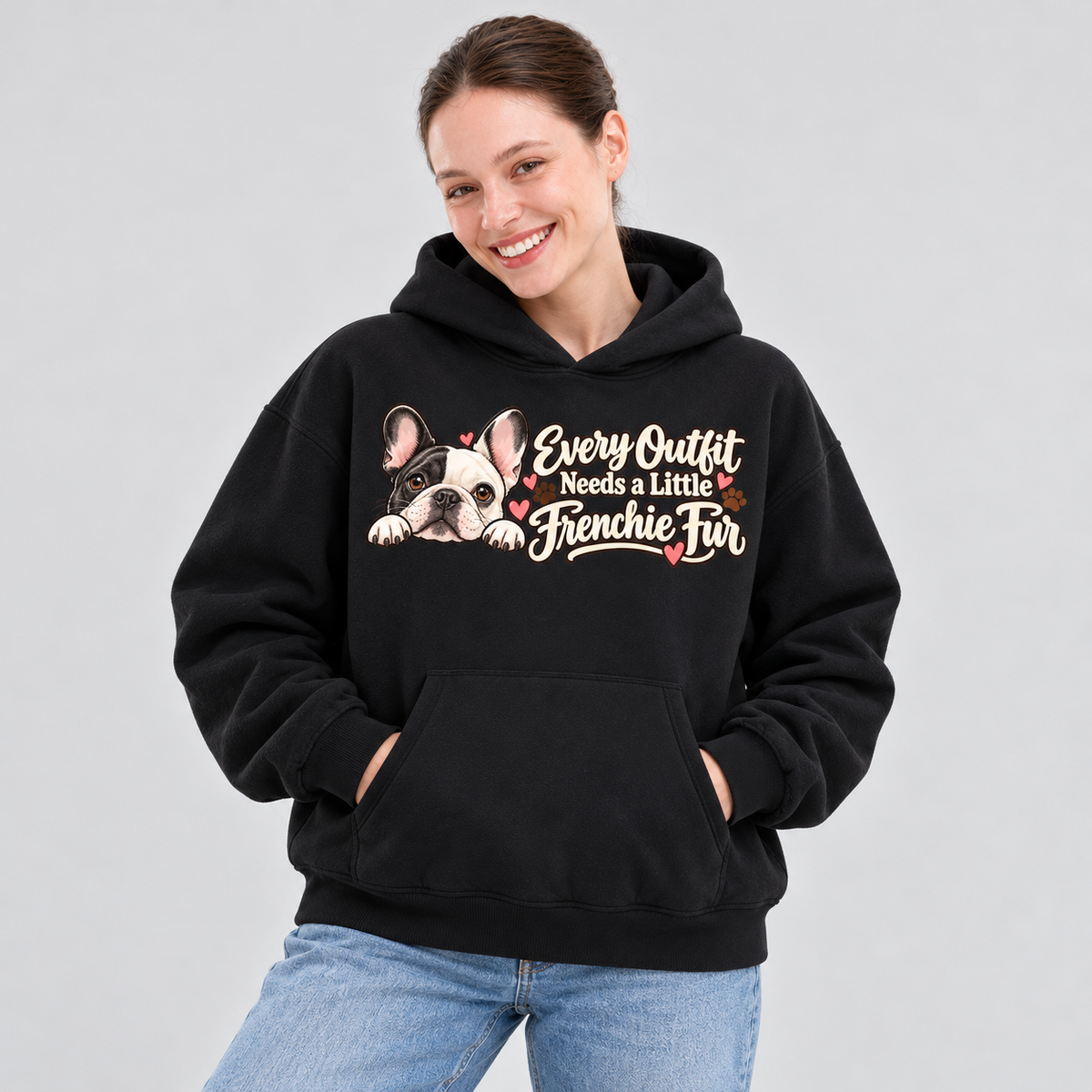 Close-up of the Every Outfit Needs a Little Frenchie Fur front print on a black French Bulldog hoodie.