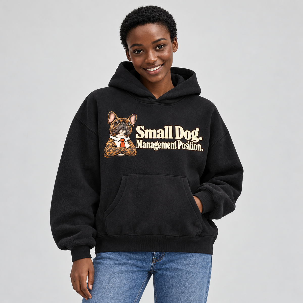 Close-up of the Small Dog. Management Position front print on a black French Bulldog hoodie.