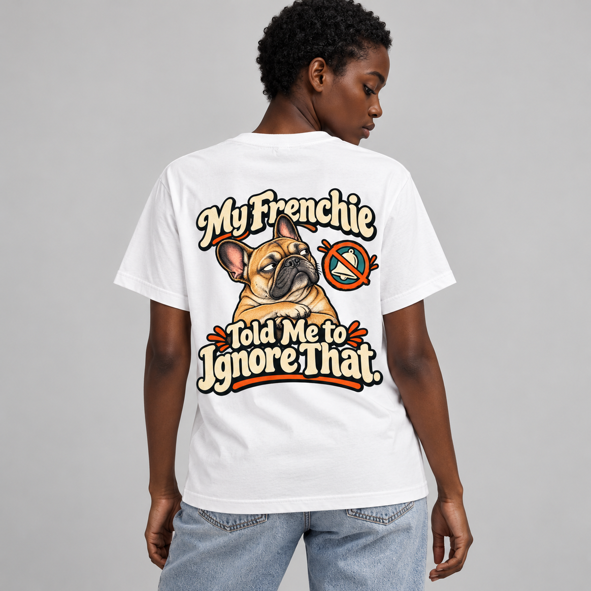 Model wearing a white French Bulldog T-shirt with the My Frenchie Told Me to Ignore That. artwork on the back