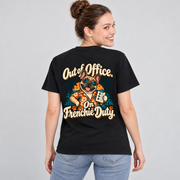 Model wearing a black French Bulldog T-shirt with the Out of Office. On Frenchie Duty. artwork on the back