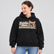 Woman wearing a black French Bulldog hoodie with the Frenchie Mom. Zero Personal Space front print.