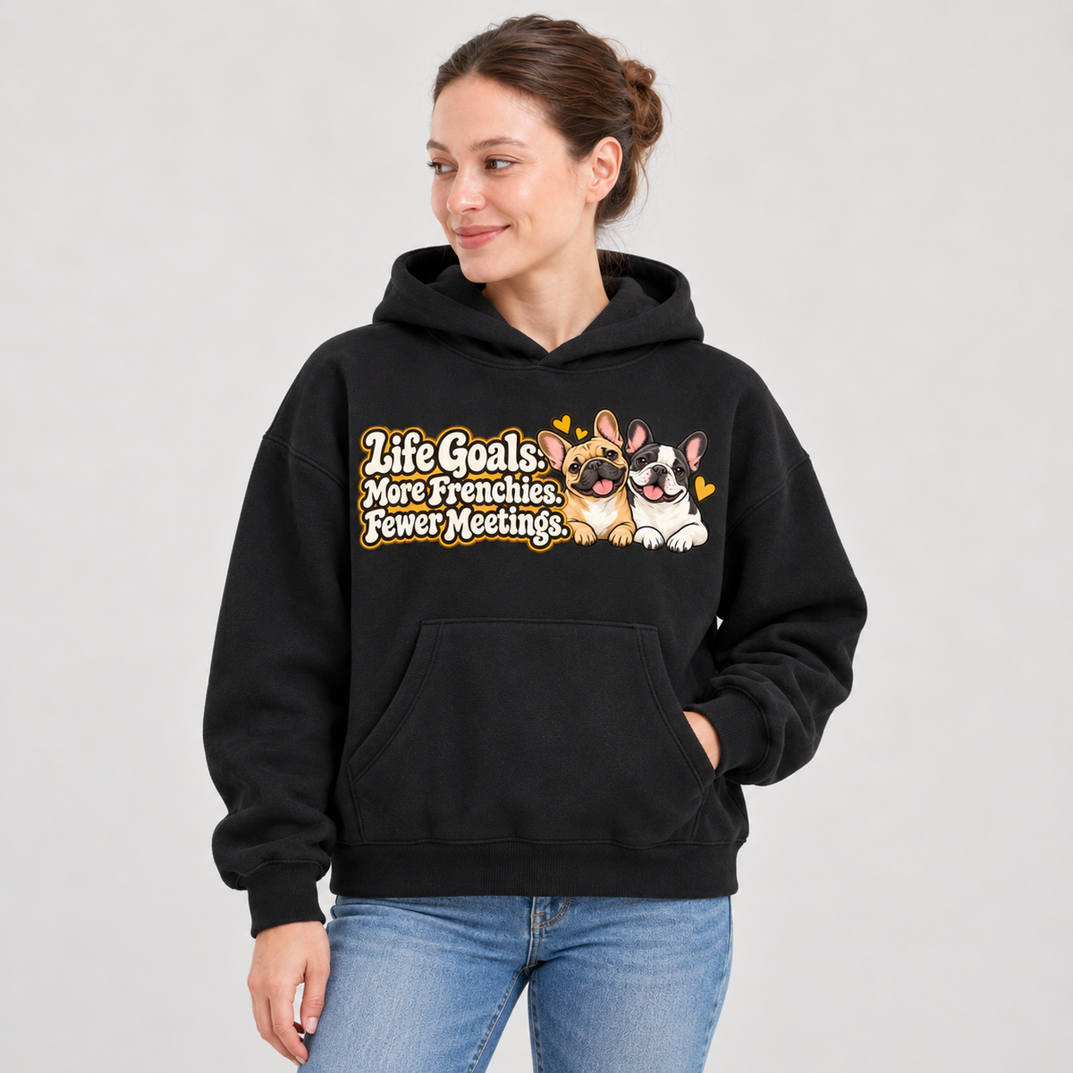 Close-up of the Life Goals: More Frenchies. Fewer Meetings front print on a black French Bulldog hoodie.