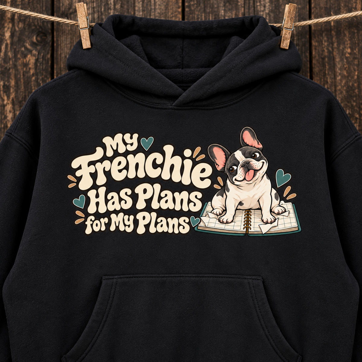 Close-up of the My Frenchie Has Plans for My Plans front print on a black French Bulldog hoodie.