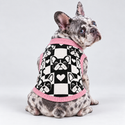 French Bulldog seated with back toward camera, head looking right, wearing pet knit sweater design 18