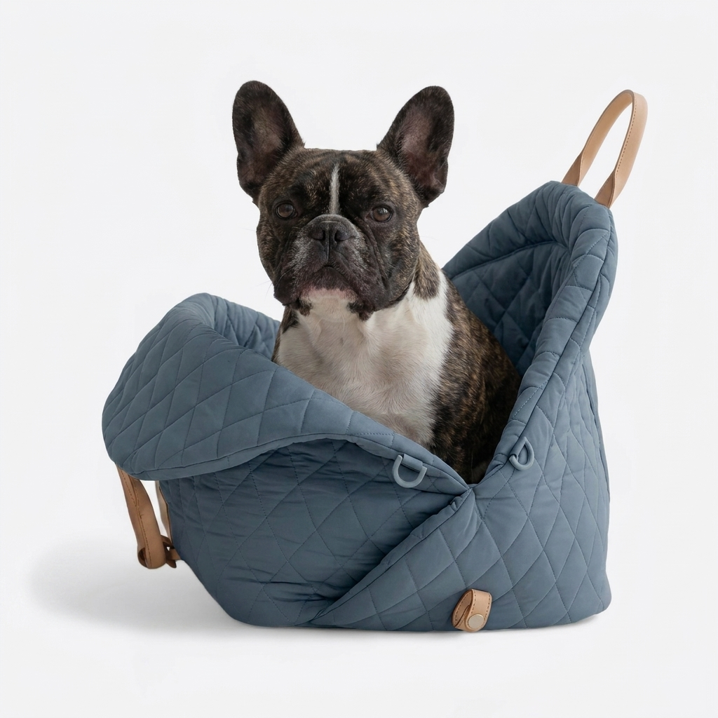 French Bulldog in blue-gray travel carrier bed