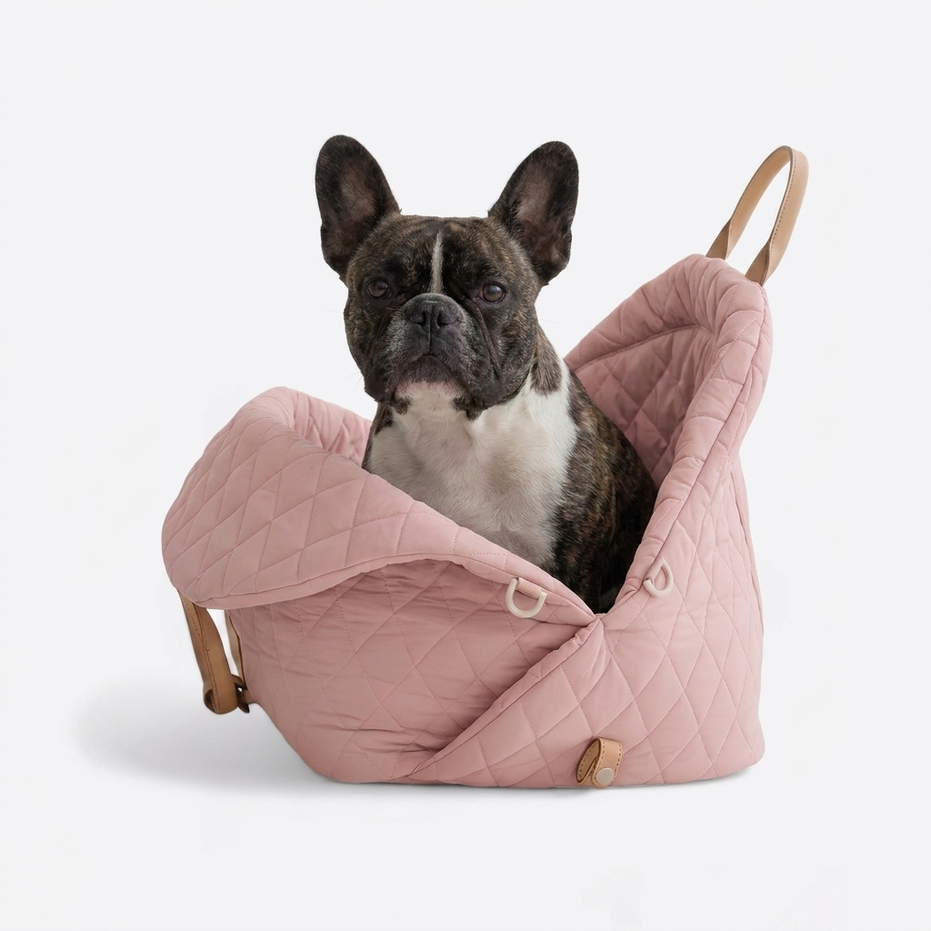 French Bulldog in pink travel carrier bed