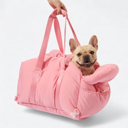 French Bulldog in pink travel carrier bag