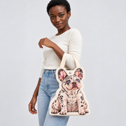 Our model carrying a personalized French Bulldog photo-shaped canvas tote by its cream handles; sample design uses a merle Frenchie photo